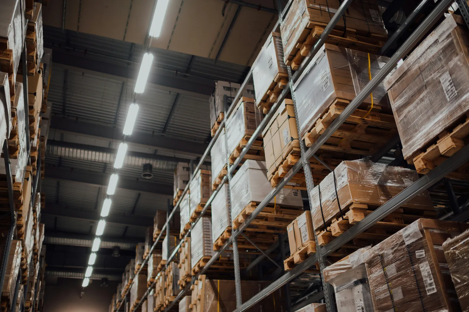 Warehouse shelves stacked with palletized inventory